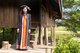 Thailand: Black Tai woman in traditional dress and headdress, Ban Na Pa Nat Tai Dam Cultural Village, Loei Province